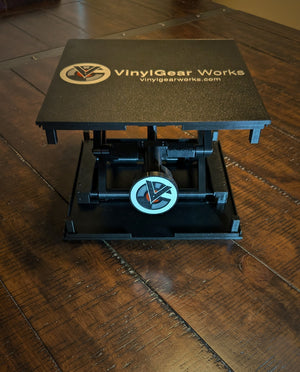 Standalone RecordStay viewed from the front, showing its platform, mechanism and adjustment knob.