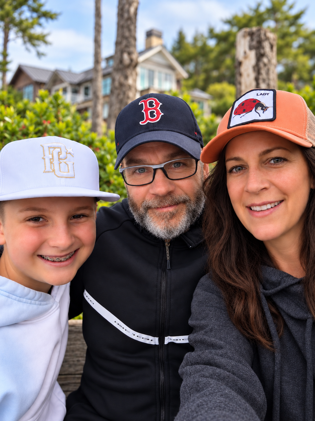 Patrick with his family outdoors.